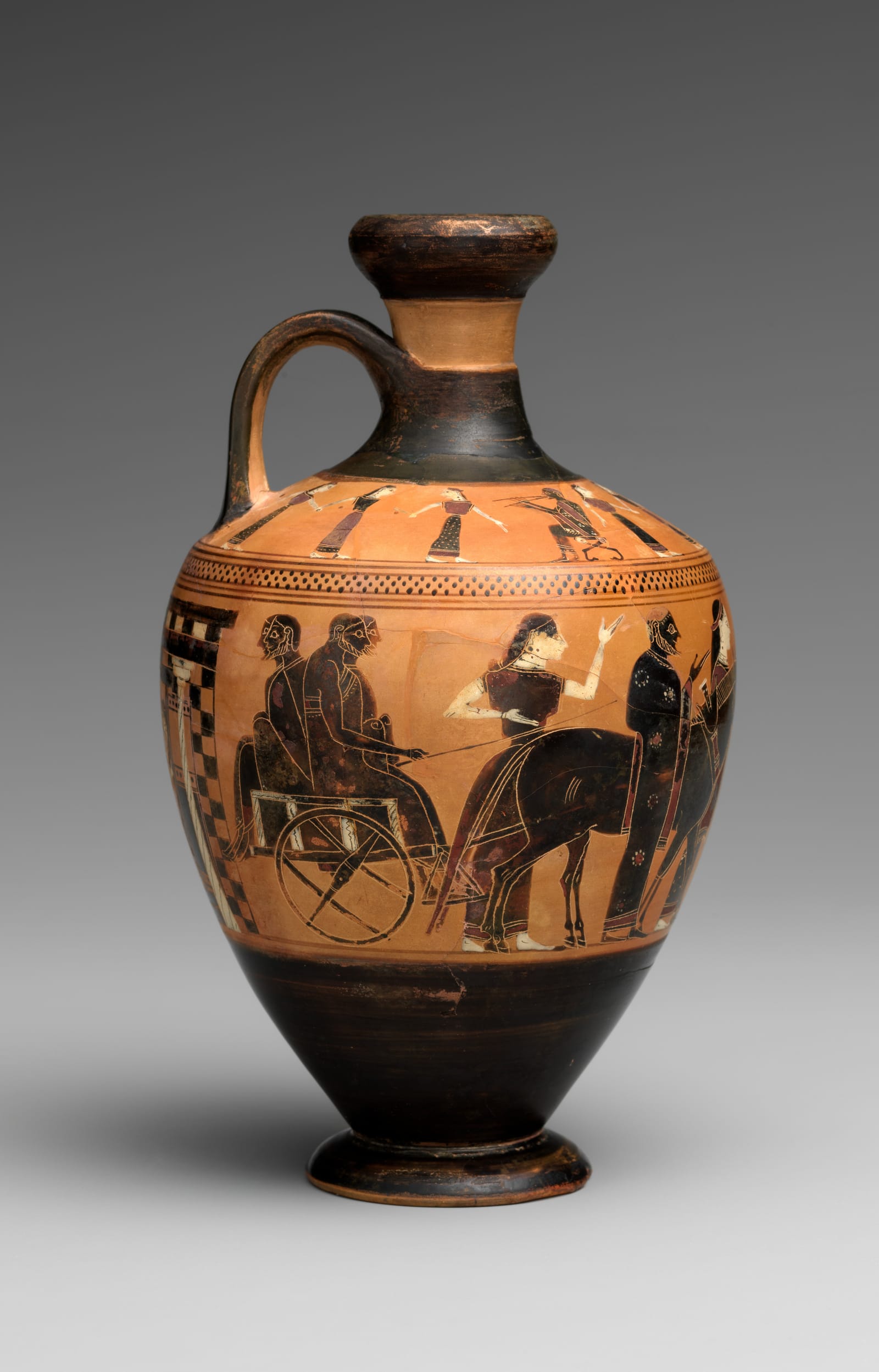 A small black-figure oil flask: on its body a bride and groom sit in a cart drawn by two donkeys, part of a wedding procession by night; on the shoulder, women dance between musicians.